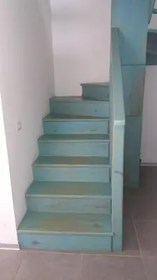 a stairway with blue steps in a room at Residencial Las Estrellas in Boca Chica