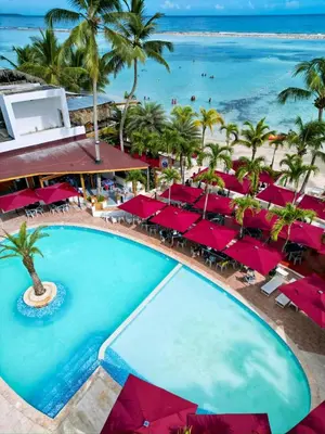 an aerial view of a resort with a large swimming pool at Boca Beach Residence hotel in Boca Chica