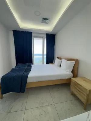 a bedroom with a large bed and a window at Boca Beach Residence hotel in Boca Chica