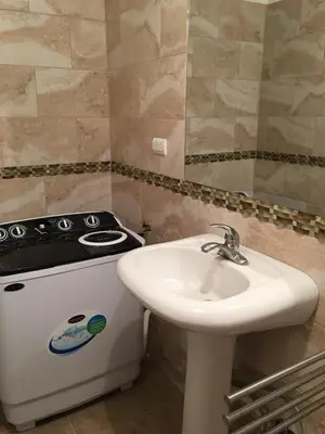 a kitchen with a sink and a stove at Casita Blanca Bayahibe in Bayahibe