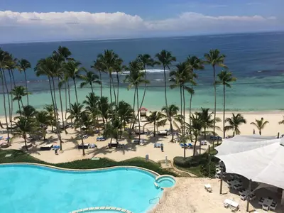an aerial view of a resort with a pool and the beach at Marbella Juan Dolio in Juan Dolio