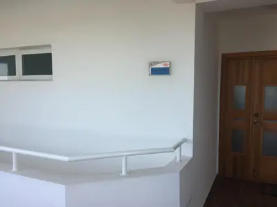 a white shelf in a room with a wooden door at Marbella Juan Dolio in Juan Dolio