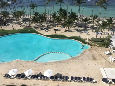 an overhead view of a swimming pool and the beach at Marbella Juan Dolio in Juan Dolio