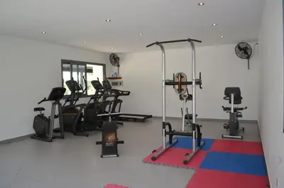 a gym with several exercise bikes in a room at Aligio Beachfront Paradise in Las Terrenas