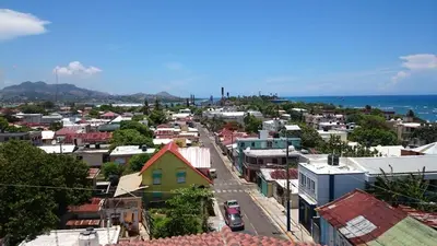 an aerial view of a city with buildings and the ocean at Luxury Karla Apartments in Las Flores