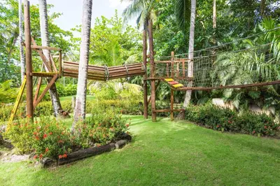 a tree house in the middle of a garden at Apartment in Sublime Samana Résidence in Las Terrenas