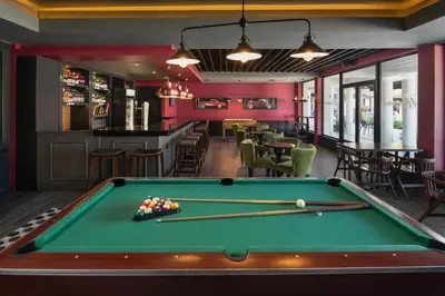 a pool table in a room with a bar at Emotions by Hodelpa Puerto Plata in San Felipe de Puerto Plata