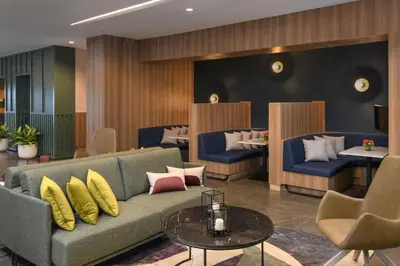 a lobby with a couch and a table at Courtyard by Marriott Santo Domingo in Santo Domingo