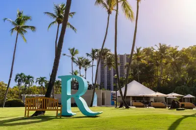 a large letter k sitting in a park with palm trees at Renaissance Santo Domingo Jaragua Hotel & Casino in Santo Domingo