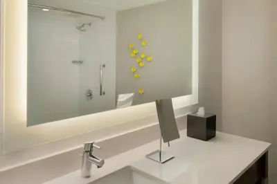 a bathroom with a sink and a shower at Renaissance Santo Domingo Jaragua Hotel & Casino in Santo Domingo
