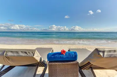 a view of the beach with chairs and the ocean at Royalton Bavaro, An Autograph Collection All-Inclusive Resort & Casino in Punta Cana