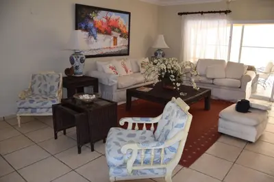 a living room with couches and chairs at Villa M-6 Metro Country Club in Juan Dolio