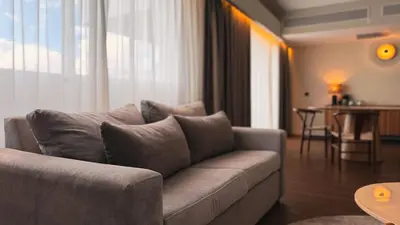 a living room with a couch and a table at Santo Domingo Bay Convention Resort & Casino in Boca Chica