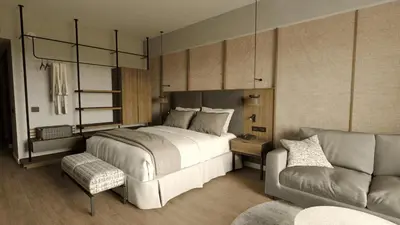 a bedroom with a large bed and a couch at Santo Domingo Bay Convention Resort & Casino in Boca Chica