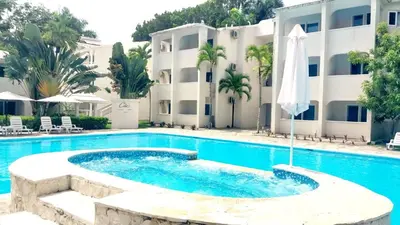 a swimming pool in front of a building at Tropical Casa Laguna in Cabarete
