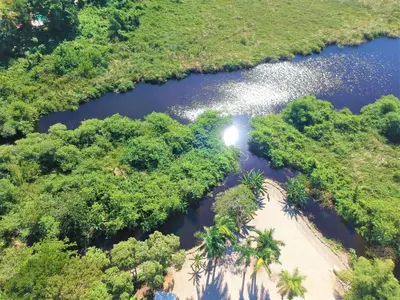 an aerial view of a river with trees at Tropical Casa Laguna in Cabarete
