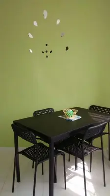 a black table with chairs and a bowl on it at Casa Vasquez in San Felipe de Puerto Plata