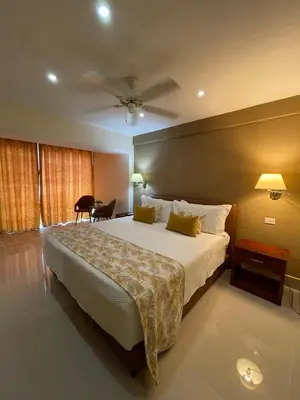 a bedroom with a large bed in a room at Nilka Hotel Boutique in Santa Bárbara de Samaná