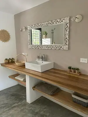 a bathroom with a sink and a mirror at La Belle Créole in Las Galeras