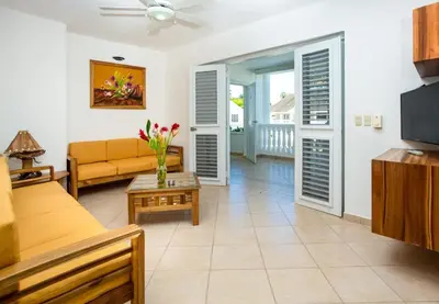 a living room with a couch and a table at Albachiara Hotel - Las Terrenas in Las Terrenas
