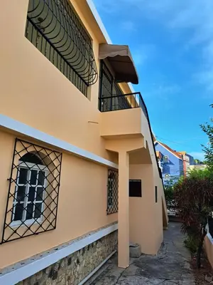 a building with a balcony on the side of it at Casa D9 in Santo Domingo