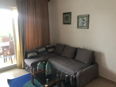a living room with a couch and a table at Vacations in the Caribbean Paradise in Sosúa