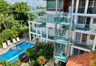 an aerial view of a building with a swimming pool at Hotel Neptuno Refugio in Boca Chica