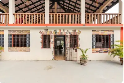 an open door to a building with a porch at Cabaña Don Tobo Jarabacoa RD in Jarabacoa