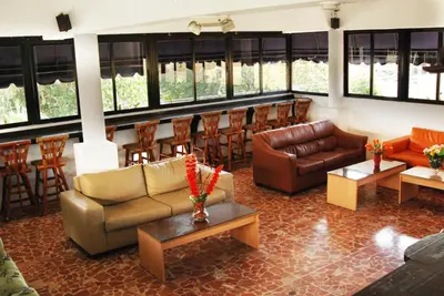a living room with couches and a bar at Royal Palace Hotel in Santo Domingo