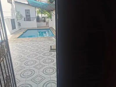 a view of a swimming pool from the door of a house at Perla de Sosua in Sosúa