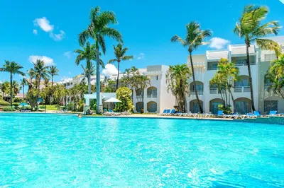 a swimming pool in front of a resort at Casa Marina Sosua, Trademark by Wyndham All Inclusive in Sosúa