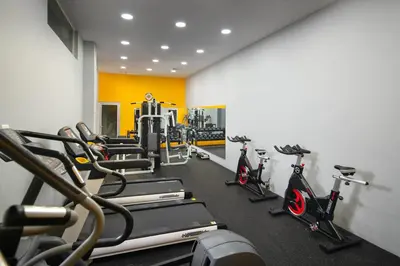 a gym with several treadmills and exercise bikes at Casa Marina Sosua, Trademark by Wyndham All Inclusive in Sosúa
