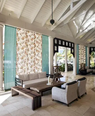 a living room with a couch and a table at VH - Gran Ventana Beach Resort in San Felipe de Puerto Plata