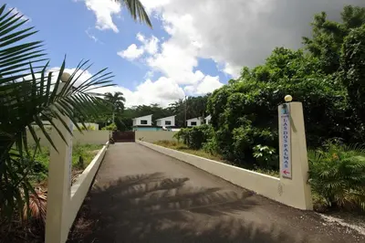 a road with a sign on the side of it at Residence Las Dos Palmas in Las Terrenas