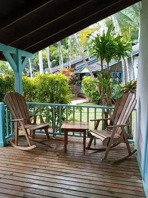two chairs and a table on a deck at Las Palmas Eco Residence in Las Terrenas
