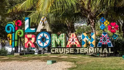 a sign that says koala cruise terminal at Hotel Olimpo in La Romana