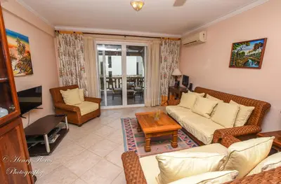 a living room with a couch and a table at Palma Real in Bayahibe