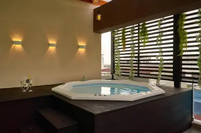 a large bathroom with a jacuzzi tub at Central Park Tower in Santo Domingo