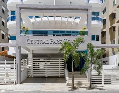 a building with a sign for the carnival paradise at Central Park Tower in Santo Domingo