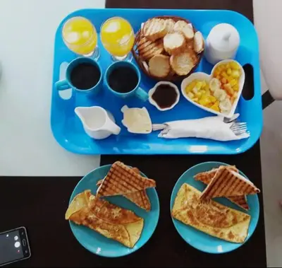 a blue tray with breakfast foods on a table at 1 Sol Dominicus Solo Adultos Habitación con Entrada Independiente y Baño Privado in Bayahibe