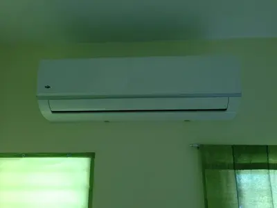 a white air conditioner on the ceiling of a room at Apartment in Plaza Europa in Sosúa