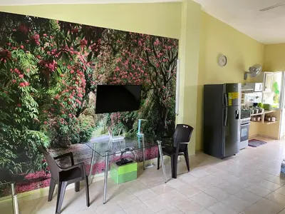 a dining room with a wall with a mural of flowers at Apartment in Plaza Europa in Sosúa