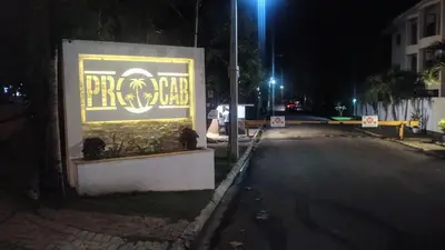 a sign on the side of a street at night at SolyViento 67 in Cabarete