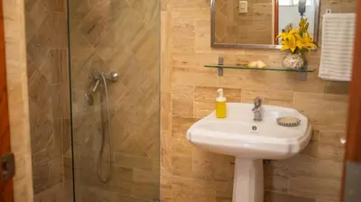 a bathroom with a sink and a shower at Monserrat Residences in Las Terrenas