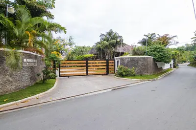 a fence on the side of a road at Monserrat Residences in Las Terrenas