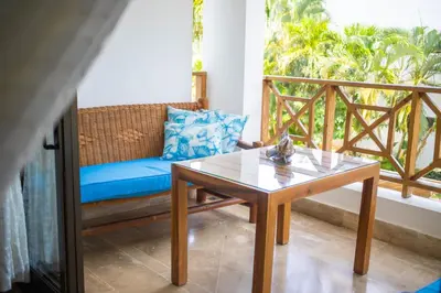 a living room with a couch and a table at Monserrat Residences in Las Terrenas