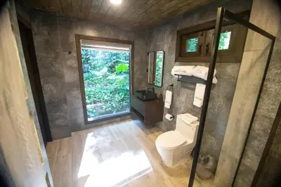 an overhead view of a bathroom with a toilet and a window at Platon Ecolodge in Santa Cruz de Barahona