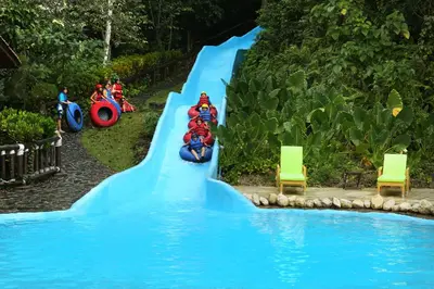 a water slide at a water park with people on motorcycles at Platon Ecolodge in Santa Cruz de Barahona