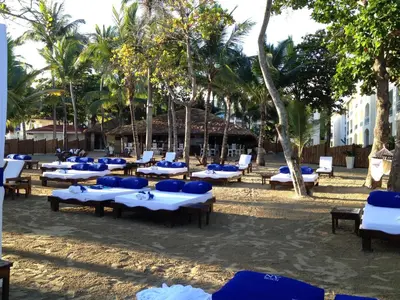 a group of tables and chairs on the beach at Junior Suite in Puerto Plata at Lifestyle Holidays Vacation Club in San Felipe de Puerto Plata
