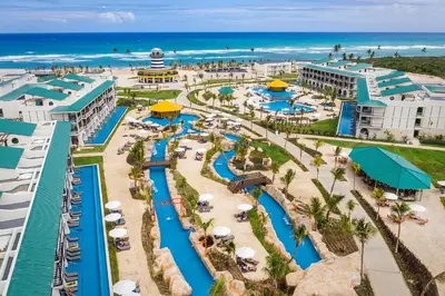 an aerial view of a resort with a water park at Ocean el Faro Resort - All Inclusive in Punta Cana